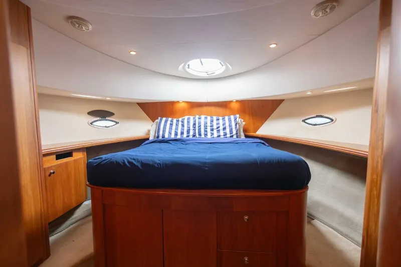 Slide: The Image of Luxurious cabin interior of 2001 Silverton 410 Sport Bridge yacht with cozy bed. - 4