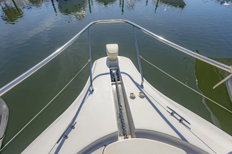 Slide: The Image of Bow view of 2001 Silverton 410 Sport Bridge yacht, featuring stainless steel railings. - 43