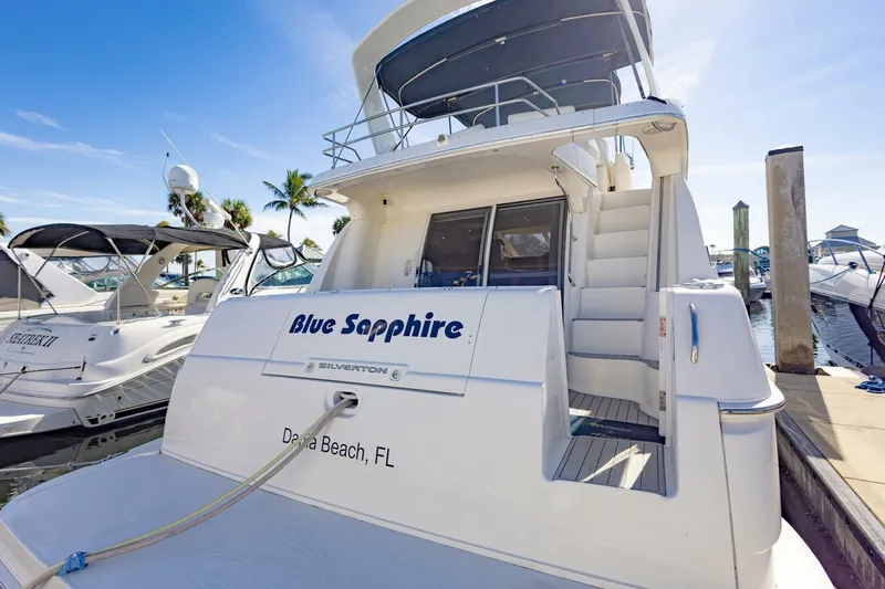 Slide: The Image of 2001 Silverton 410 Sport Bridge yacht docked, named "Blue Sapphire," in Dania Beach, FL. - 54