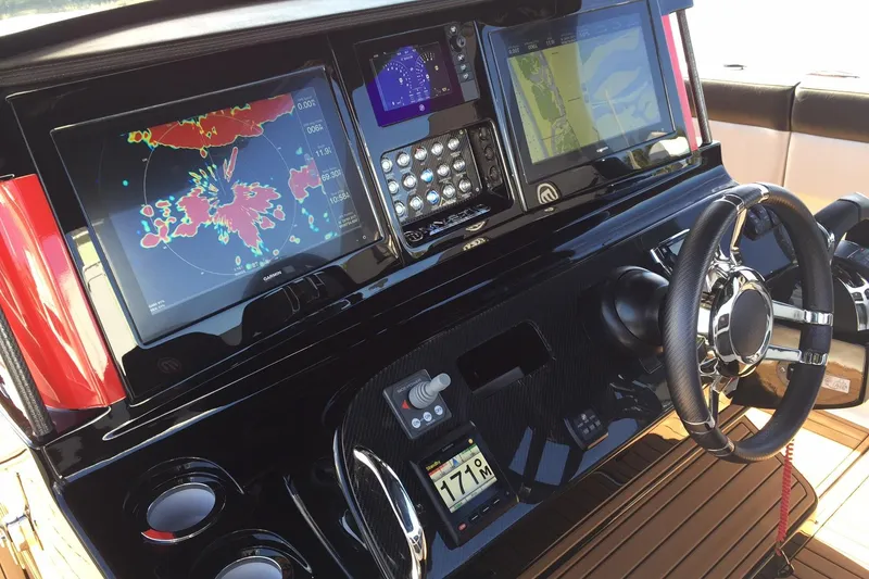 Slide: The Image of 2017 Mystic Powerboats M4200 dashboard with advanced navigation and control systems. - 5