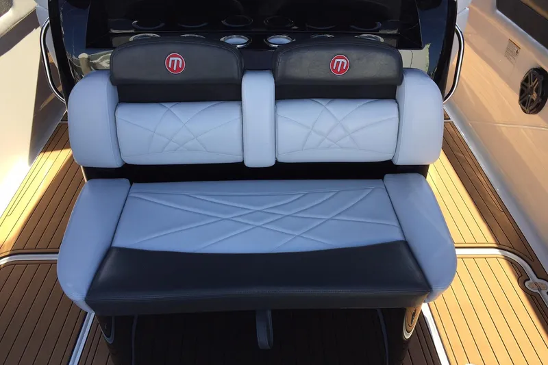 Slide: The Image of 2017 Mystic Powerboats M4200 seating with stylish black and white upholstery. - 6