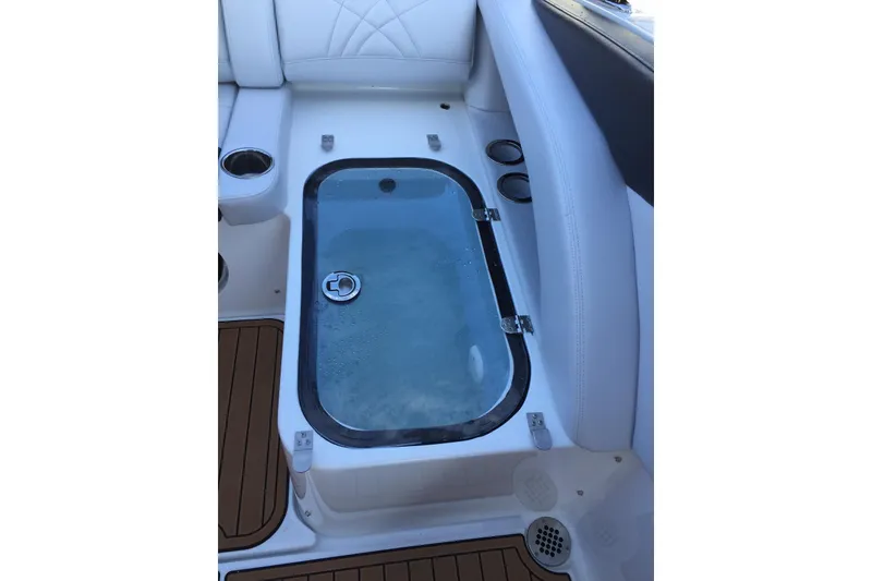 Slide: The Image of Livewell on 2017 Mystic Powerboats M4200, featuring white seating and teak flooring. - 7