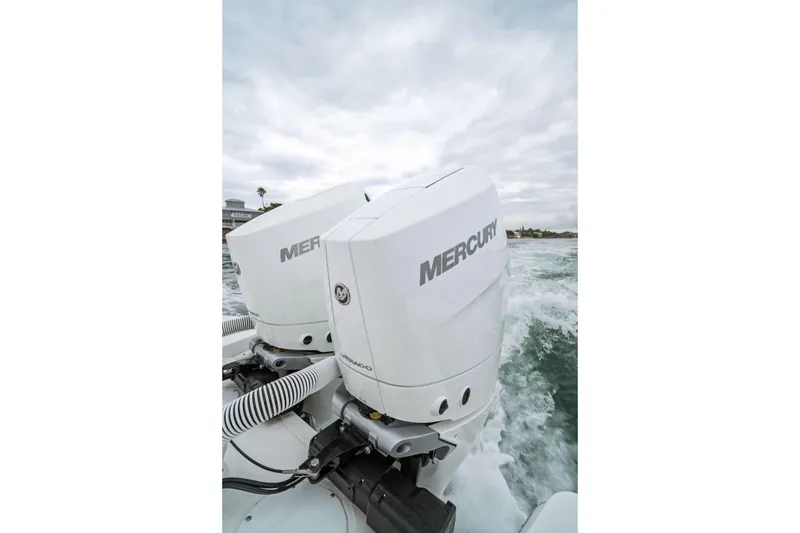 Slide: The Image of Twin Mercury outboard engines on 2026 Everglades 315 Center Console boat. - 12