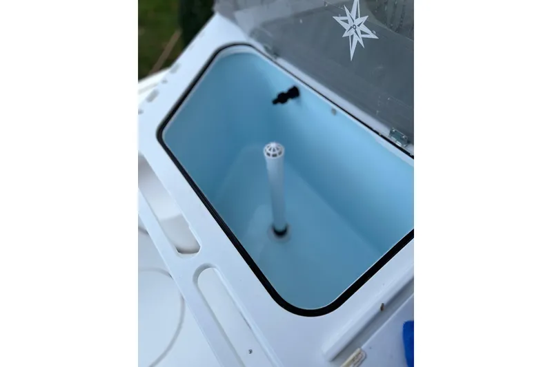 Slide: The Image of Livewell compartment on 2025 NorthCoast 285 HT boat, featuring a sleek design. - 13