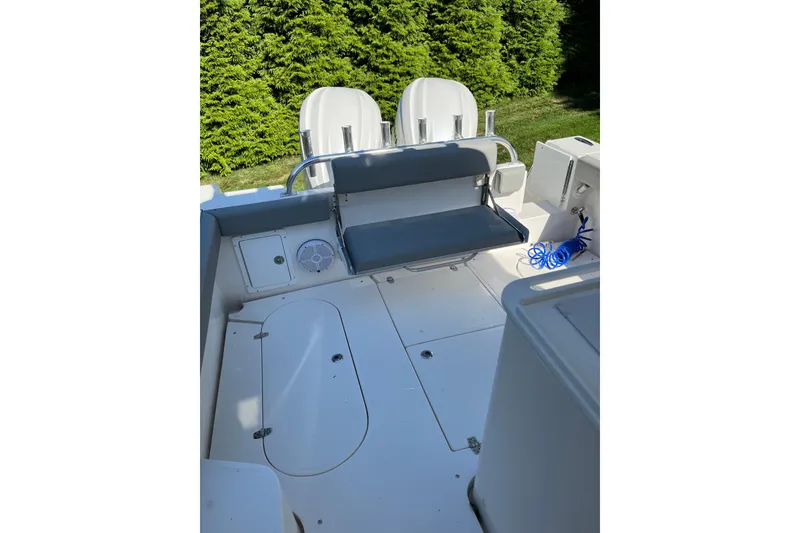 Slide: The Image of 2025 NorthCoast 285 HT boat interior with seating and storage compartments. - 15