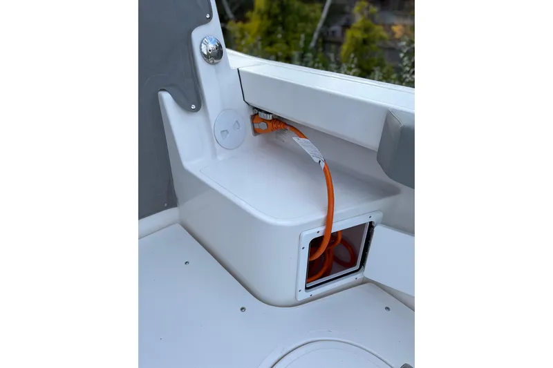 Slide: The Image of 2025 NorthCoast 285 HT boat interior with orange cable storage compartment. - 18