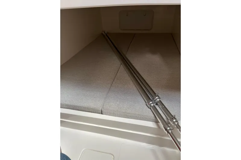 Slide: The Image of Interior cabin of 2025 NorthCoast 285 HT boat with cushioned seating. - 30