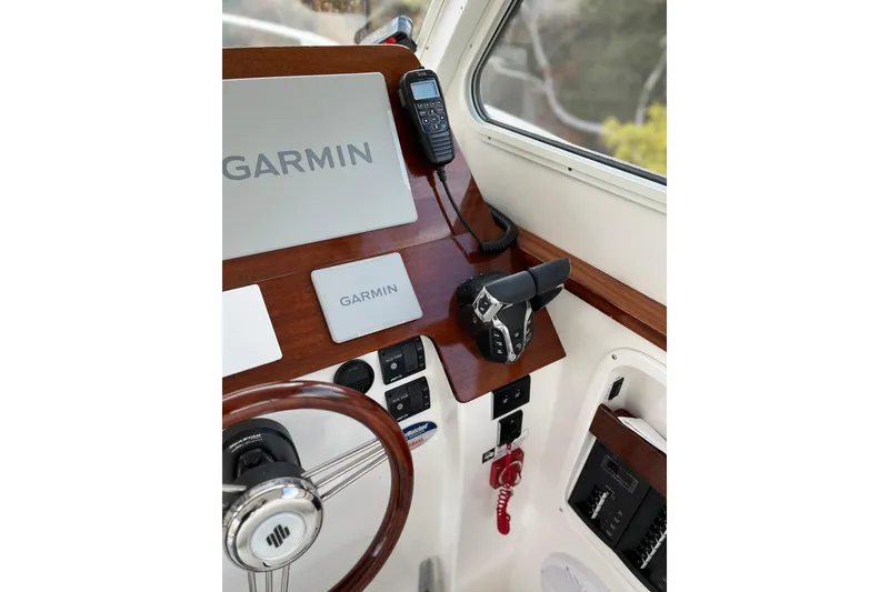 Slide: The Image of NorthCoast 285 HT 2025 helm with Garmin electronics and control panel. - 5