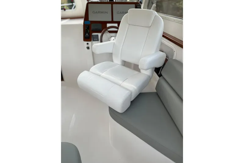 Slide: The Image of Luxury seating in 2025 NorthCoast 285 HT boat cockpit with Garmin displays. - 6