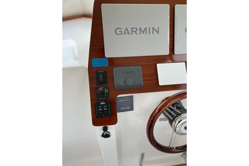 Slide: The Image of Helm of 2025 NorthCoast 285 HT boat featuring Garmin navigation system. - 7