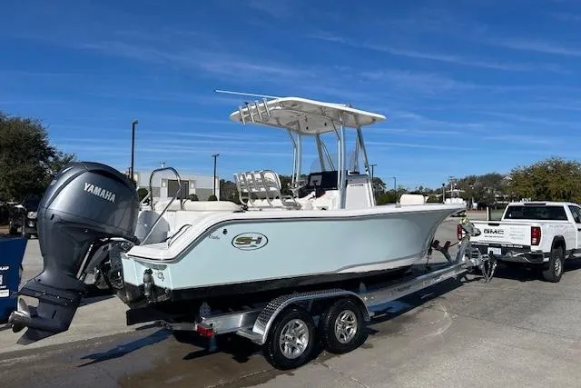 Slide: The Image of 2024 Sea Hunt Ultra 229 boat on trailer, featuring Yamaha outboard motor. - 16