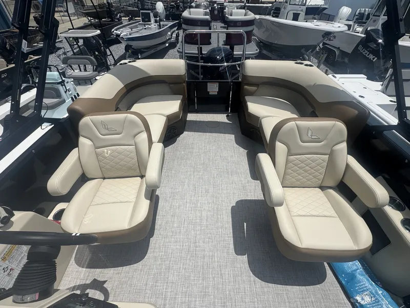 Slide: The Image of The image shows the interior of a 2026 Lowe LS Walk Thru 210 boat with beige seating. - 6