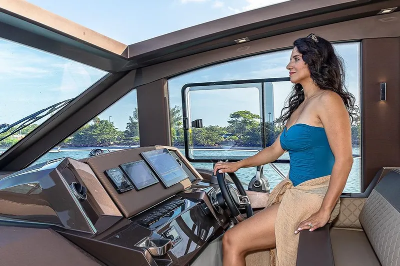 Slide: The Image of Luxurious 2023 Galeon 425 HTS yacht interior with waterfront cityscape view. - 10