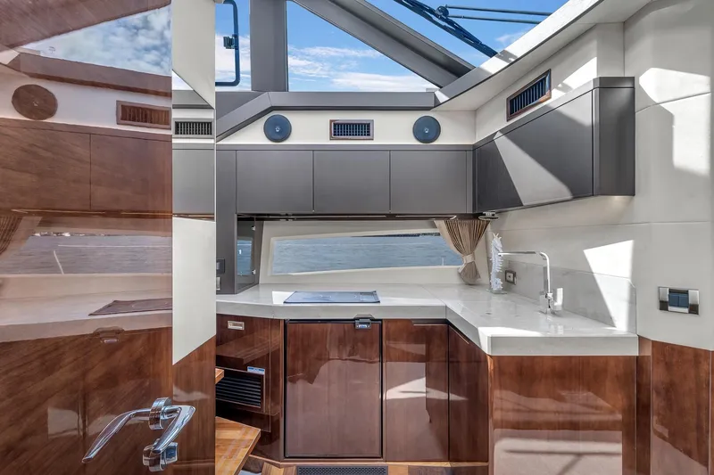 Slide: The Image of Luxurious interior of 2023 Galeon 425 HTS yacht with modern kitchen design. - 28