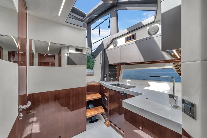 Slide: The Image of Luxurious interior of 2023 Galeon 425 HTS yacht with modern kitchen and ocean view. - 29