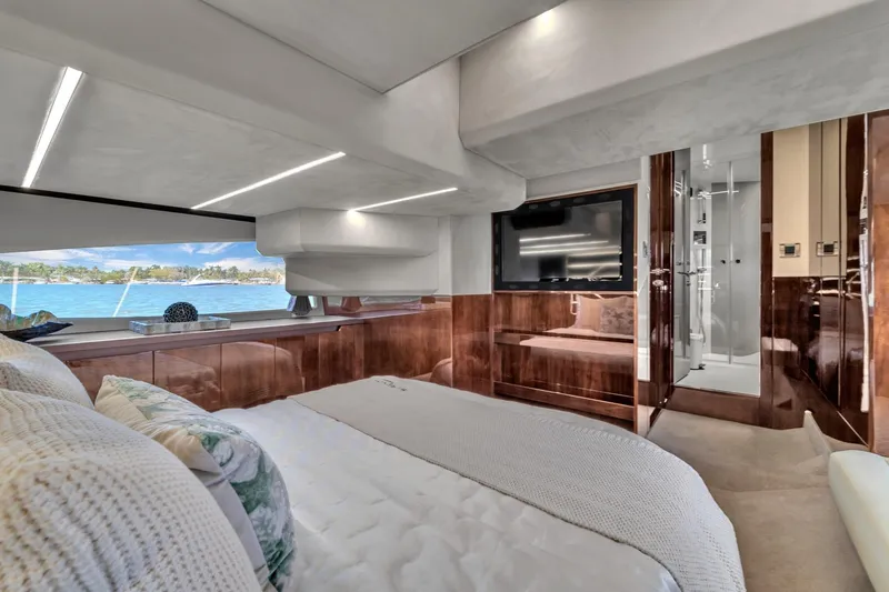 Slide: The Image of Luxurious interior of 2023 Galeon 425 HTS yacht with elegant wood finishes and scenic window view. - 38