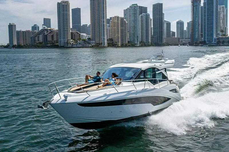 Slide: The Image of 2023 Galeon 425 HTS yacht cruising on a sunny day, showcasing sleek design and luxury. - 5
