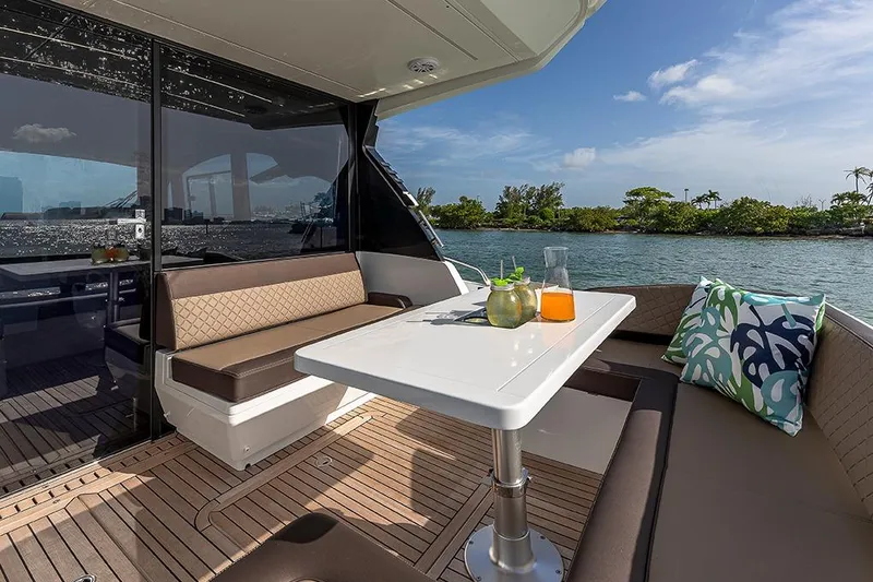 Slide: The Image of Galeon 425 HTS 2023 yacht on calm waters with luxurious interior. - 7