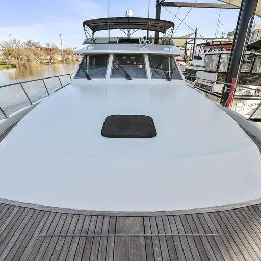 Slide: The Image of Vic Franck 65 Pilot House 1991 yacht docked, front deck view. - 13