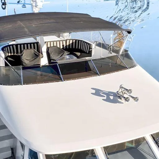 Slide: The Image of 1991 Vic Franck 65 Pilot House yacht with shaded seating area. - 15