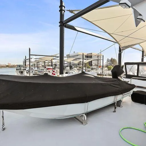 Slide: The Image of Vic Franck 65 Pilot House 1991 yacht with covered boat on deck at marina. - 27