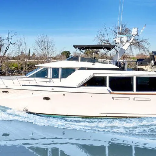 Slide: The Image of 1991 Vic Franck 65 Pilot House yacht cruising on a sunny day. - 3