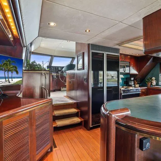 Slide: The Image of Luxurious interior of a 1991 Vic Franck 65 Pilot House yacht with modern kitchen and pilot area. - 34