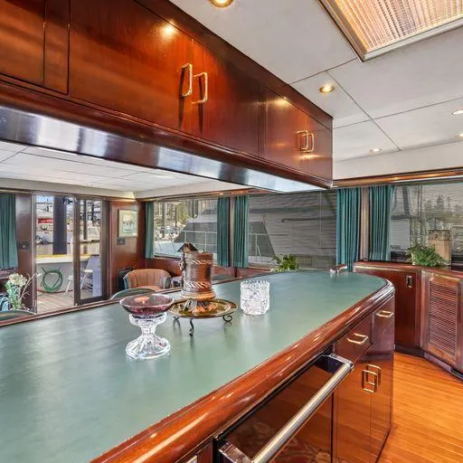 Slide: The Image of Interior of 1991 Vic Franck 65 Pilot House yacht with elegant wooden cabinetry. - 38