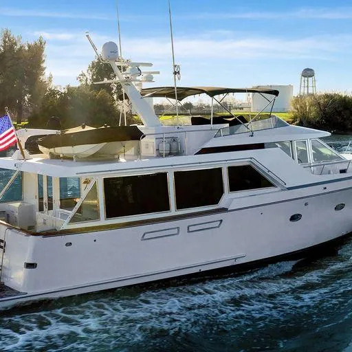 Slide: The Image of 1991 Vic Franck 65 Pilot House yacht cruising on a sunny day. - 4