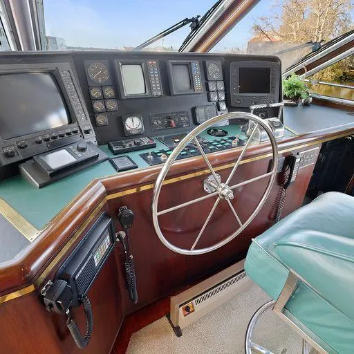 Slide: The Image of Pilot house of a 1991 Vic Franck 65 yacht with navigation instruments and steering wheel. - 44