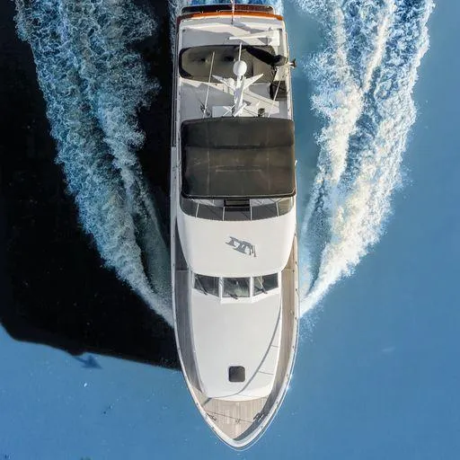 Slide: The Image of Aerial view of 1991 Vic Franck 65 Pilot House yacht cruising on water. - 9