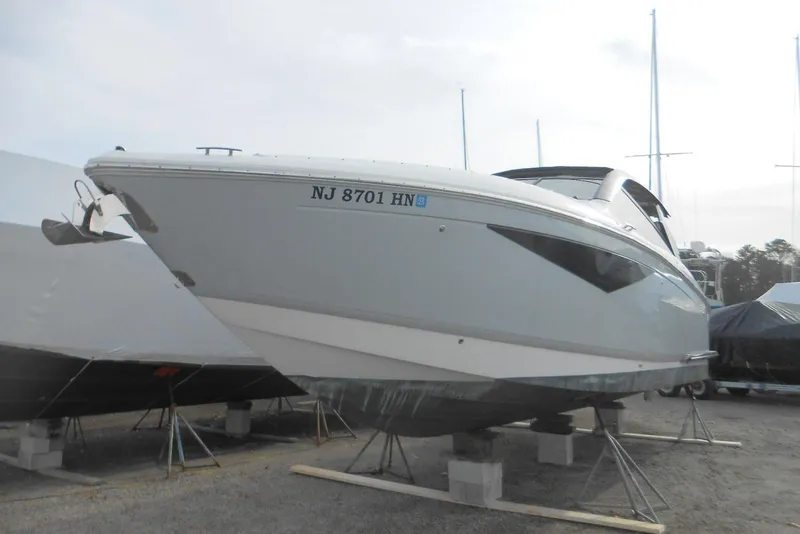 The Image of 2020 Cobalt A36BR boat on stands, side view, with registration number NJ 8701 HN. - 14