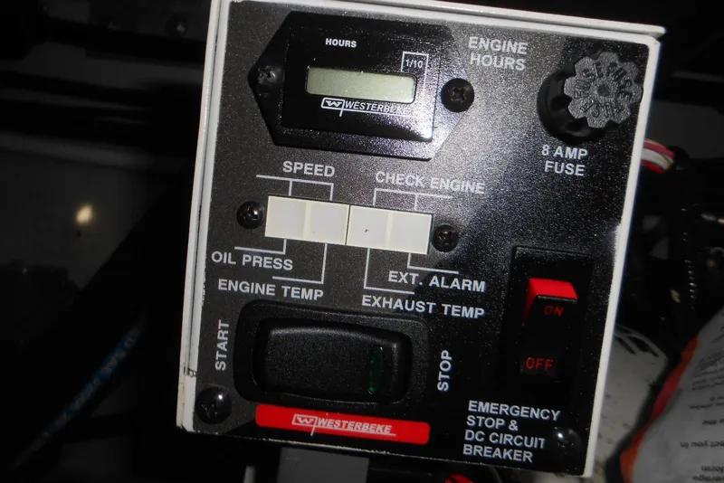 Slide: The Image of Control panel of a 2020 Cobalt A36BR boat with engine hours display and switches. - 31
