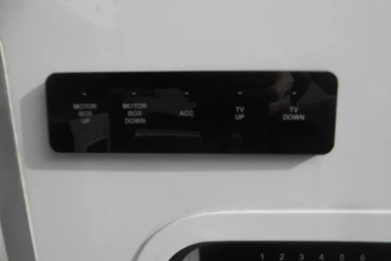 Slide: The Image of Control panel on a 2020 Cobalt A36BR boat, featuring motor and TV adjustments. - 34