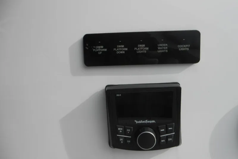 Slide: The Image of Control panel and audio system on 2020 Cobalt A36BR boat dashboard. - 35