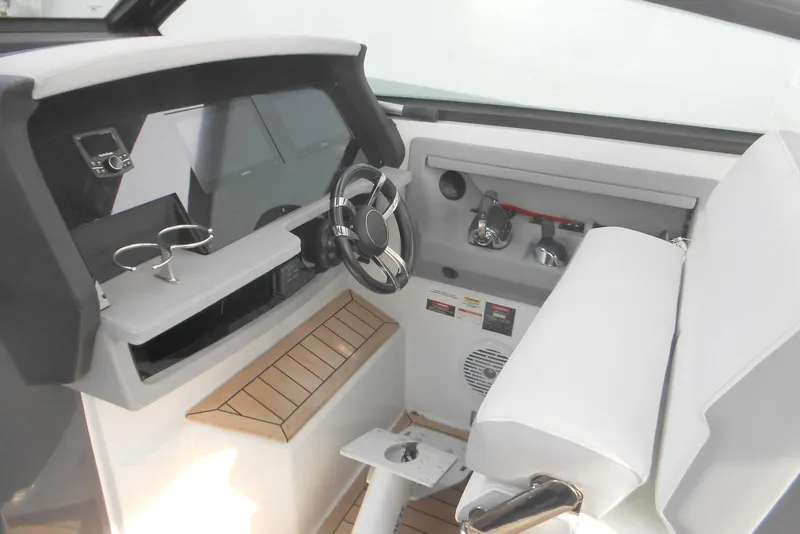 Slide: The Image of 2020 Cobalt A36BR boat cockpit with modern steering and controls. - 36