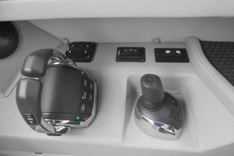 Slide: The Image of Control panel of a 2020 Cobalt A36BR boat with joystick and throttle controls. - 38