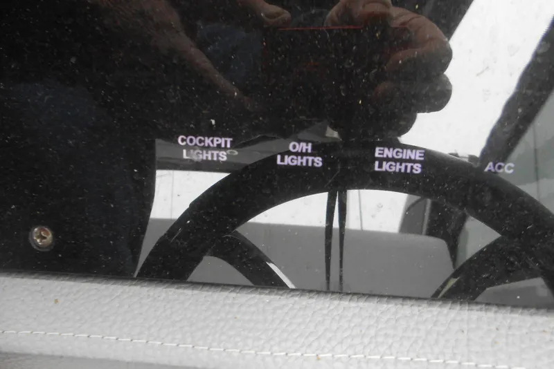 Slide: The Image of Control panel of a 2020 Cobalt A36BR boat with various light switches. - 42