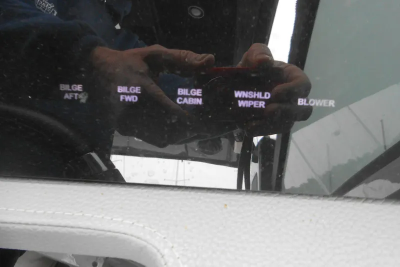 Slide: The Image of Control panel of a 2020 Cobalt A36BR boat with bilge and wiper switches. - 43