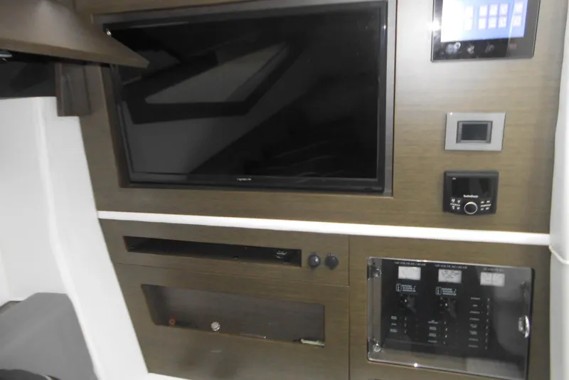 Slide: The Image of Interior of 2020 Cobalt A36BR boat featuring a modern entertainment system. - 46