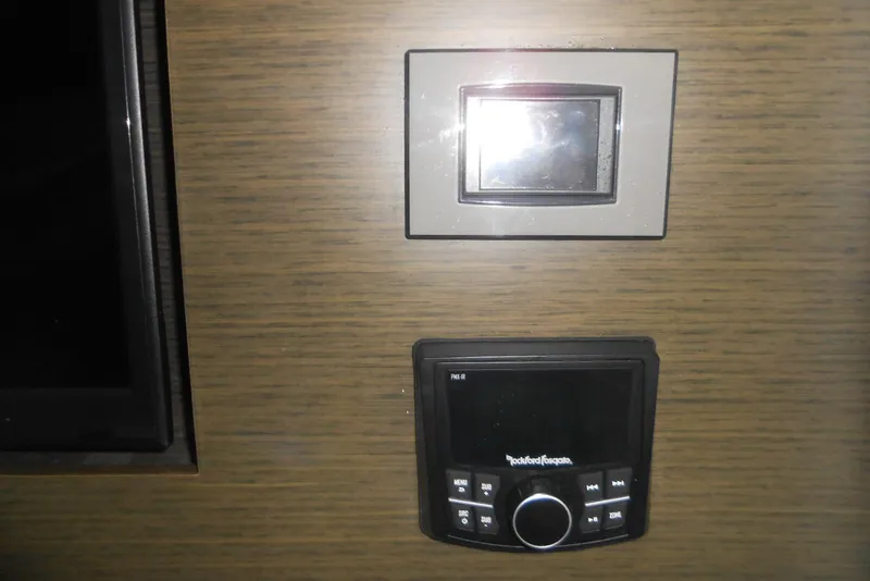 Slide: The Image of Control panel and audio system in 2020 Cobalt A36BR boat interior. - 48