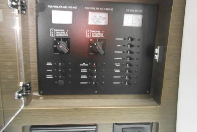 Slide: The Image of Electrical control panel on a 2020 Cobalt A36BR boat. - 49