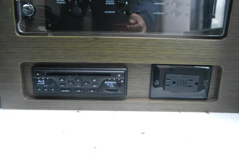 Slide: The Image of 2020 Cobalt A36BR control panel with Blu-ray player and power outlet. - 50