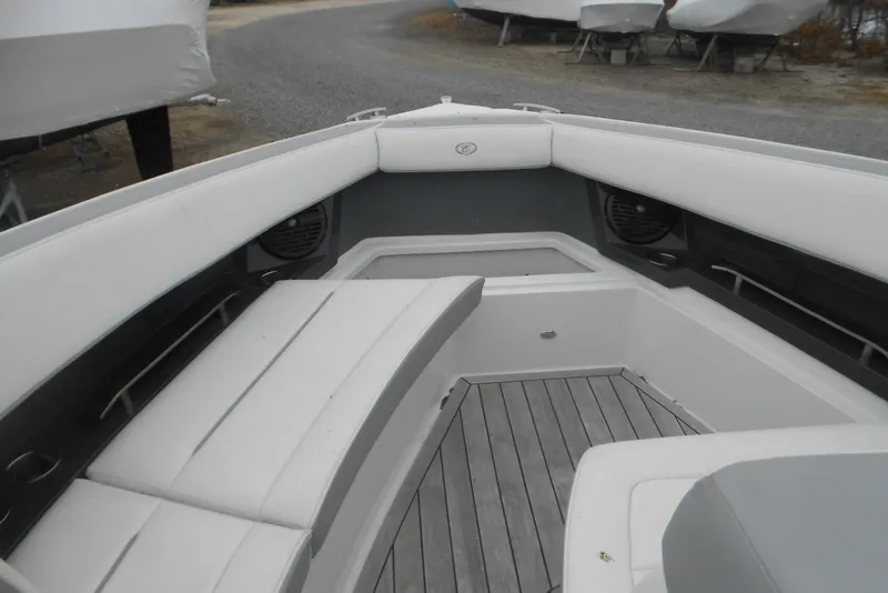 Slide: The Image of 2020 Cobalt A36BR boat interior with white seating and wood flooring. - 53
