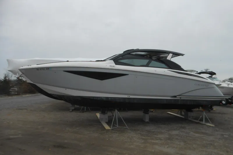 Slide: The Image of 2020 Cobalt A36BR boat on stands, side view, outdoors. - 59