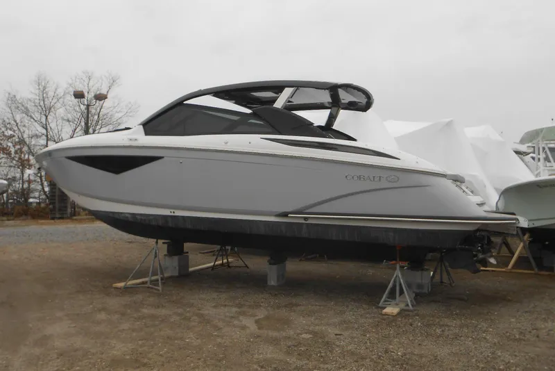 Slide: The Image of 2020 Cobalt A36BR boat on stands, outdoor storage, overcast day. - 60