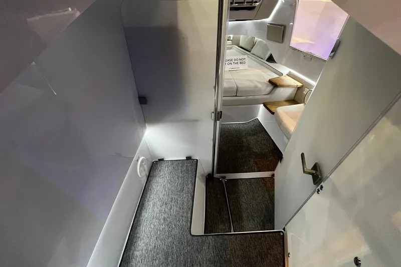 Slide: The Image of Interior cabin of 2026 Axopar 37 XC Cross Cabin with modern design and cozy seating. - 11