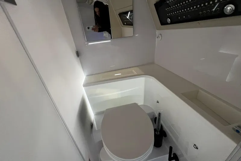 Slide: The Image of 2026 Axopar 37 XC Cross Cabin bathroom with modern fixtures and sleek design. - 13