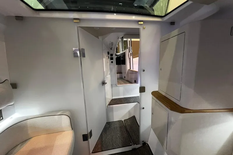 Slide: The Image of Interior of 2026 Axopar 37 XC Cross Cabin, featuring modern design and comfortable seating. - 17