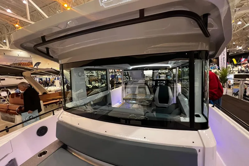 Slide: The Image of 2026 Axopar 37 XC Cross Cabin boat interior at a boat show, showcasing modern design. - 24